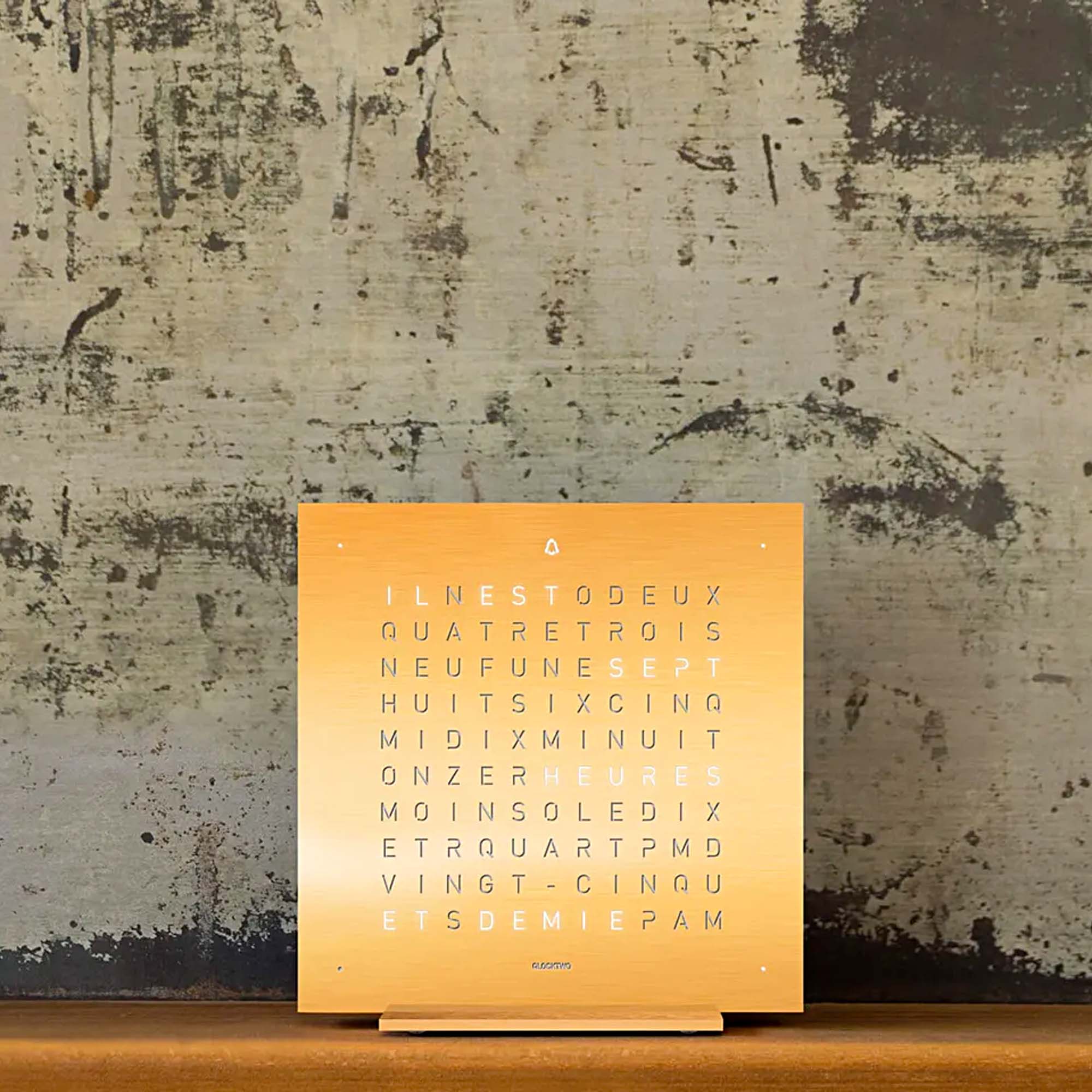 A statement of precision and restraint, the QLOCKTWO EARTH 13.5 Golden Legend transforms time into language, finished in solid gold for subtle impact.