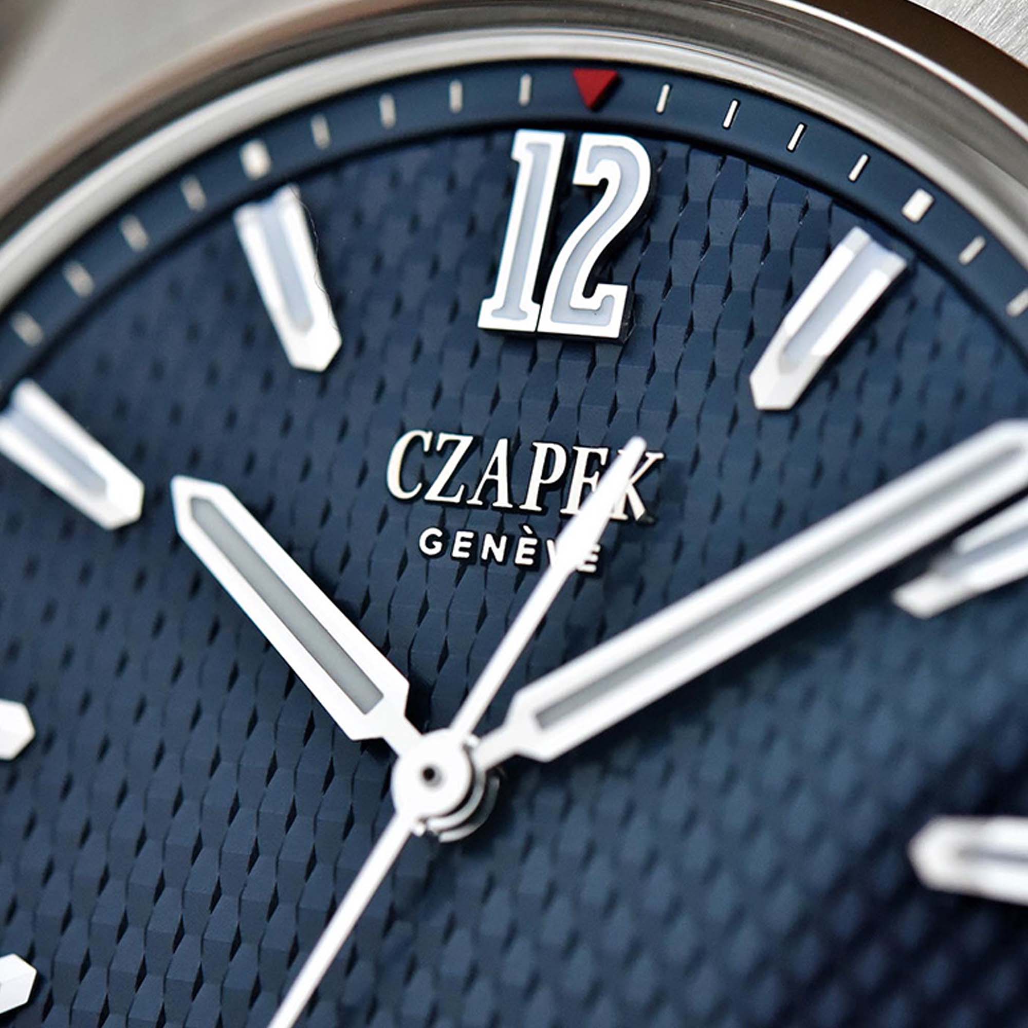 The Czapek Antarctique Passage de Drake Aqua Blue pairs a textured blue dial with a slim steel case and integrated bracelet.