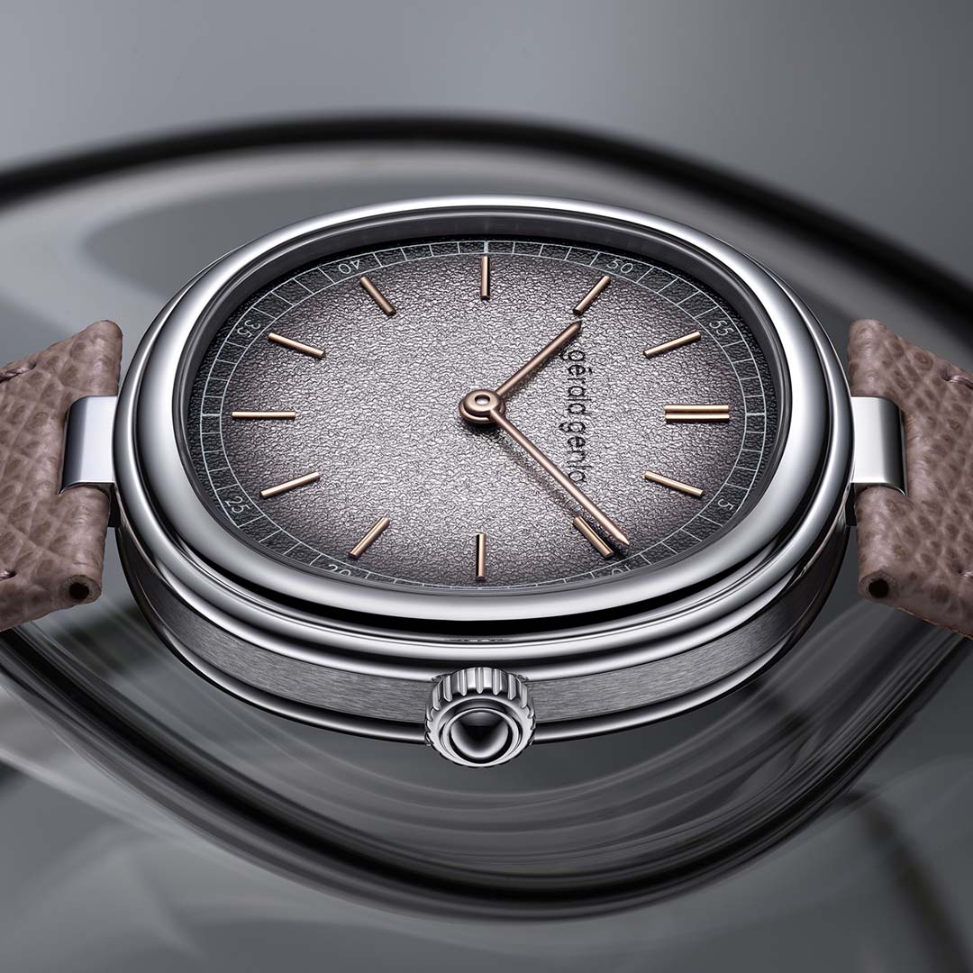 Shop the Gerald Genta Genève Time Only Grafite in white gold, a sophisticated cushion shaped watch with silver grained dial and elegant 4N rose gold markers.