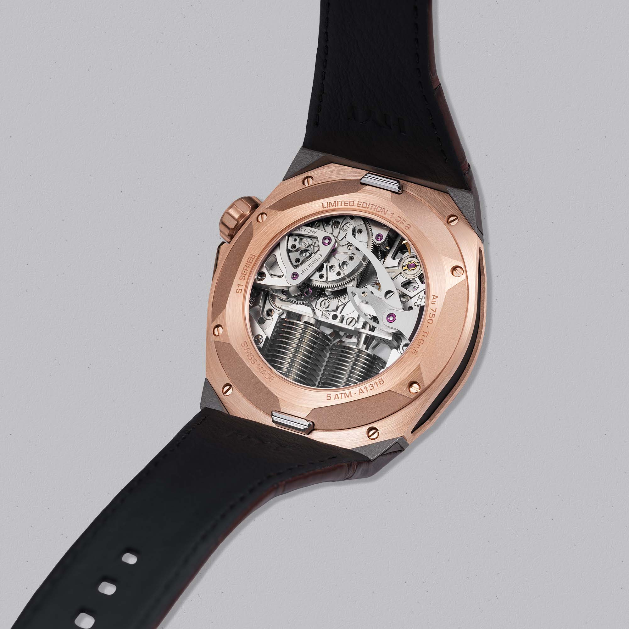 Explore the HYT S1 5N Gold Titanium Cigare, a limited edition of 8 featuring fluid hours, skeletonised mechanics, and a striking contrast of gold warmth and industrial titanium.