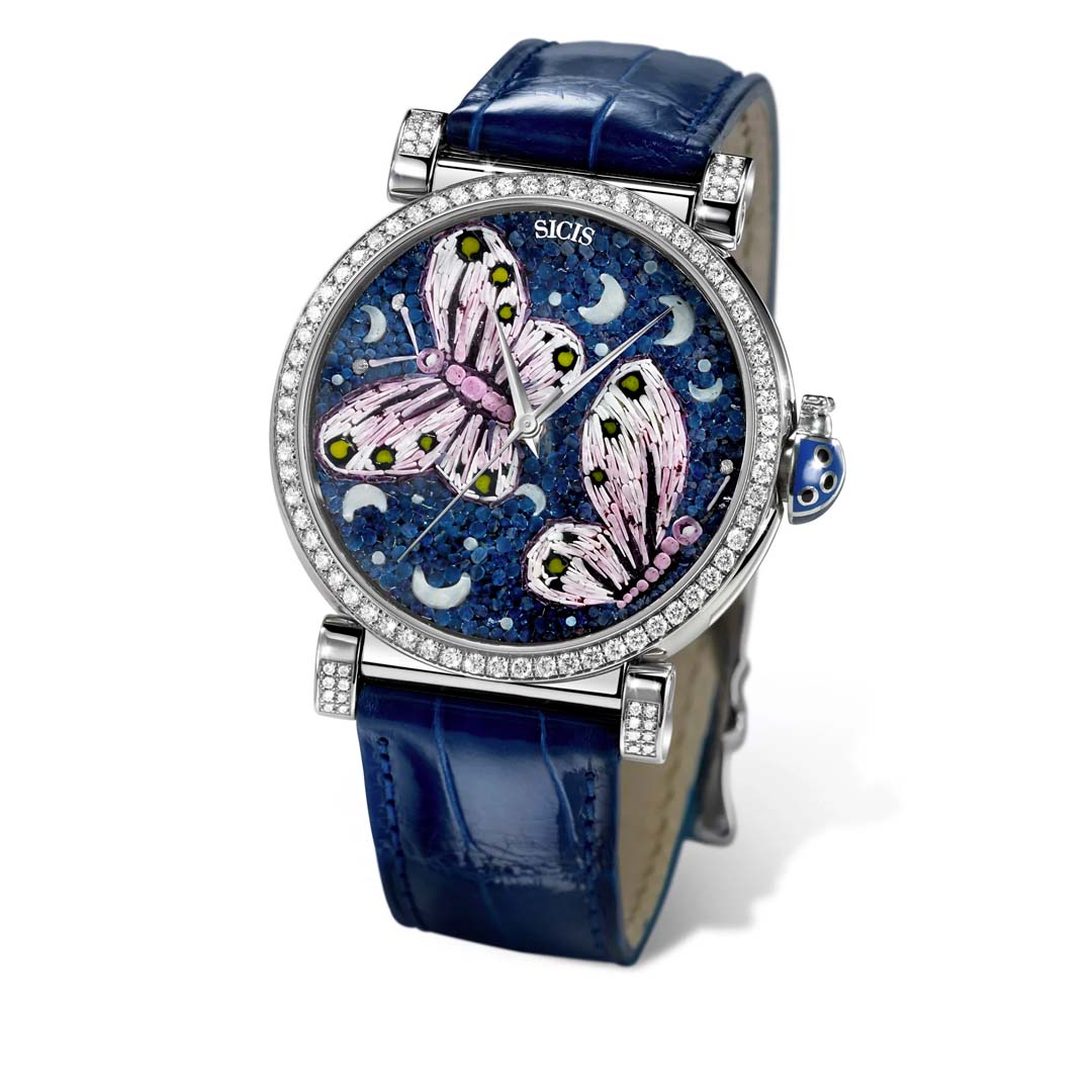 The SICIS Flutterby Desire Watch 1 blends Italian micromosaic art with fine jewellery, featuring butterfly motifs, diamonds, and vibrant colors.