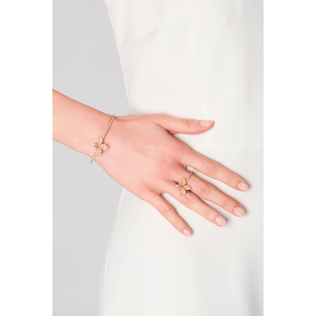 Crafted in 18K rose gold, the Petit Garden Ring features white and champagne diamonds in a graceful, nature-inspired setting. Understated luxury with radiant detail. SKU 16801R.