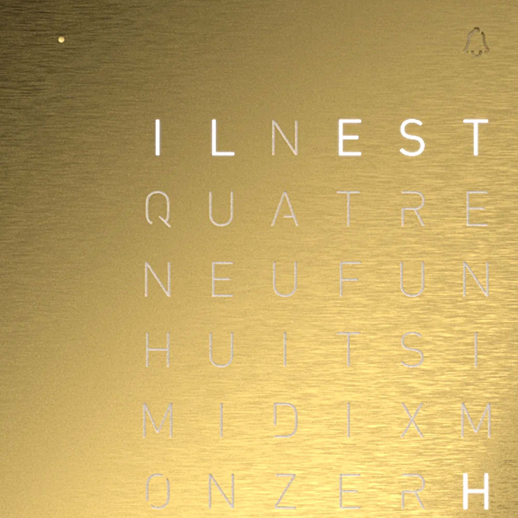 QLOCKTWO EARTH 13.5 Golden Legend combines minimalist typography with a gold front panel, offering a distinctive approach to timekeeping and interior presence.