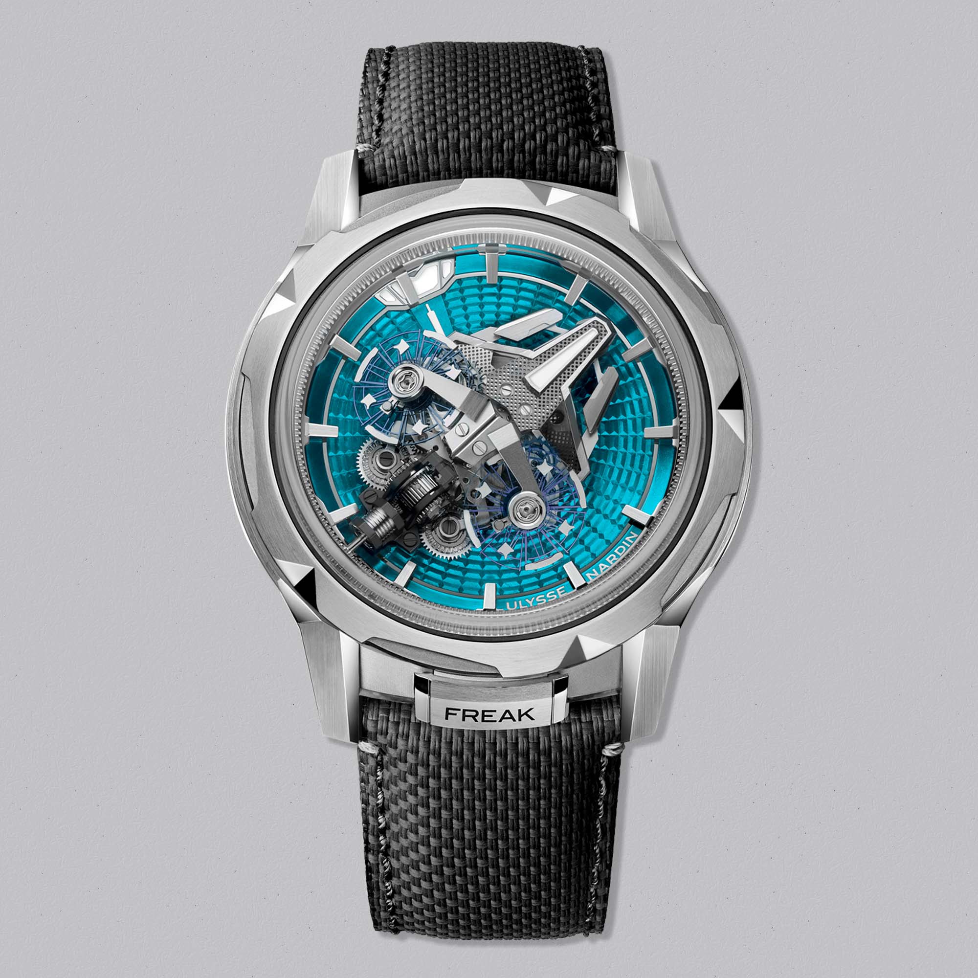 	The Ulysse Nardin Freak S Enamel Blue fuses cutting-edge mechanics with ocean-blue enamel artistry, featuring twin oscillators in celestial motion.