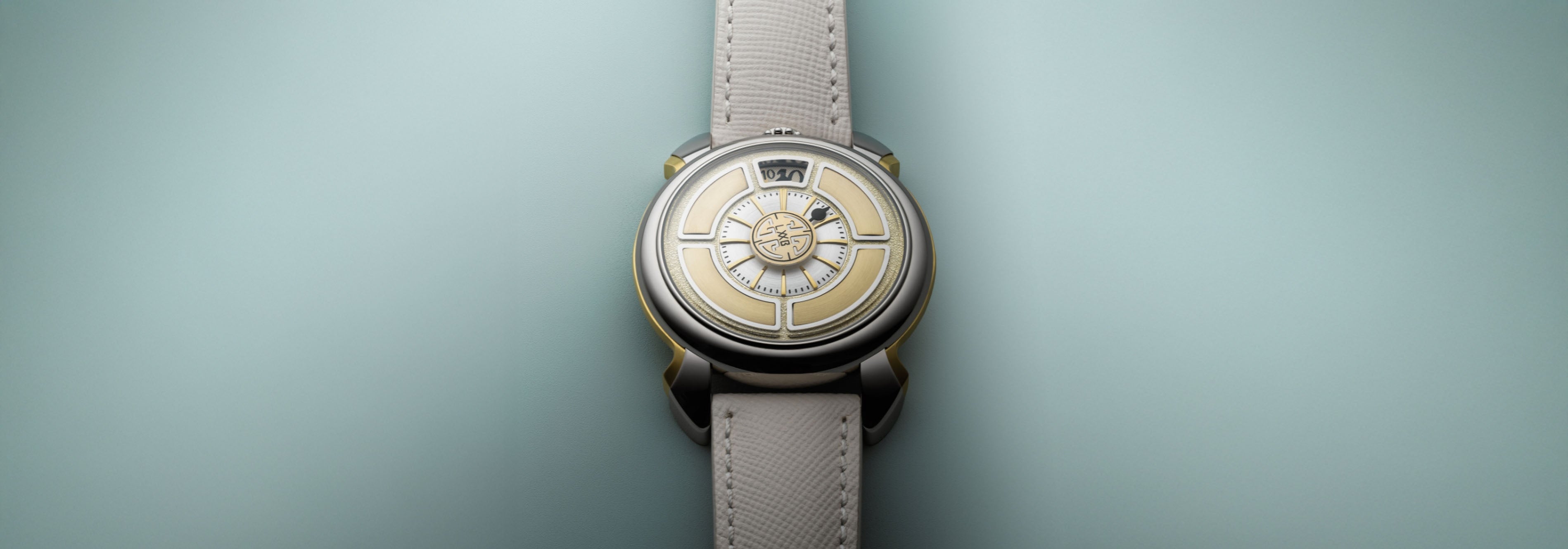 Wristwatch with a detailed face on a light green background