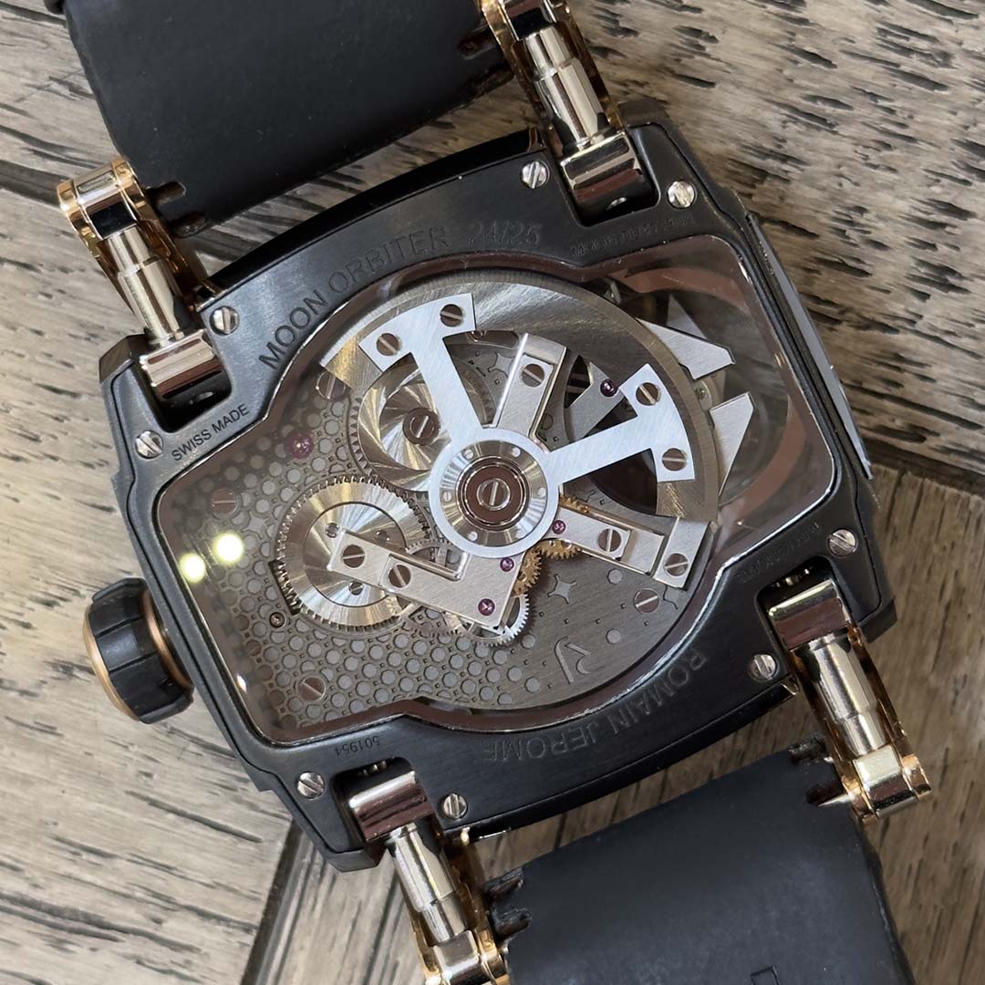 Discover the Romain Jérôme Moon Orbiter Moon Dust DNA Tourbillon in rose gold, a rare limited edition of 25 combining authentic Moon dust and a flying tourbillon.