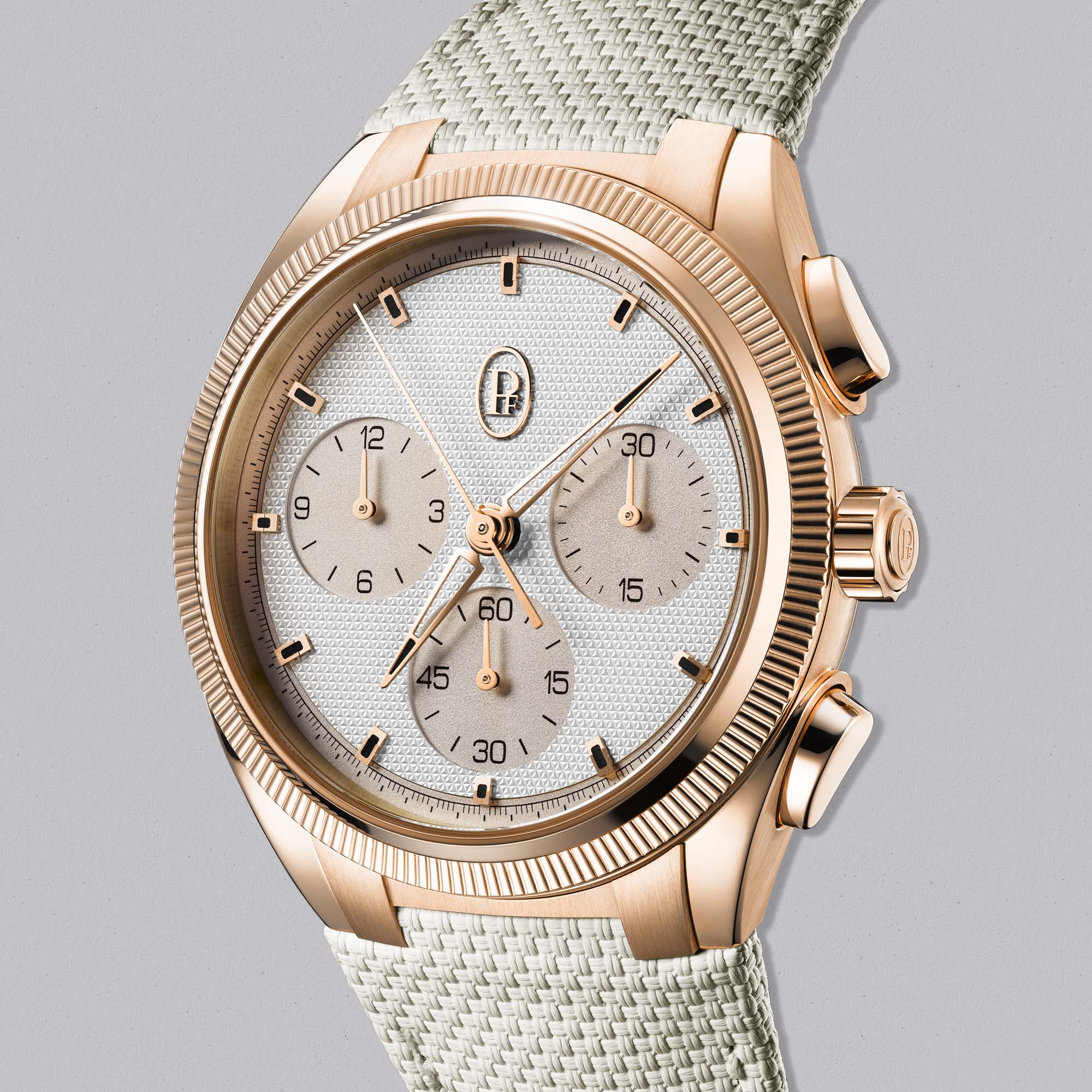 The Parmigiani Tonda PF Sport Chronograph pairs 18k rose gold with a silver sandstone dial, delivering COSC-certified performance and luxury style.