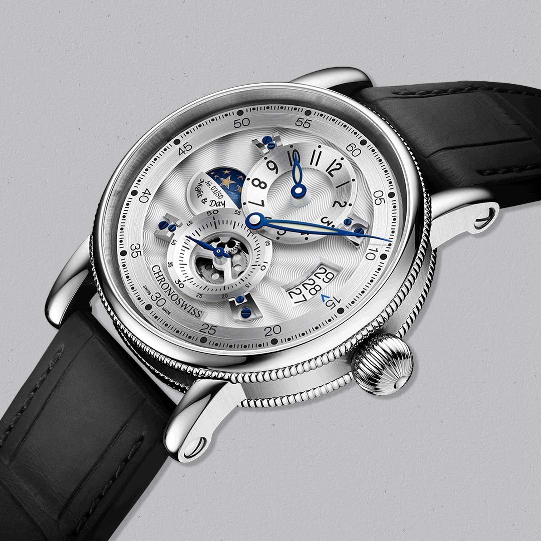 The Evolution Night & Day Whiteout by Chronoswiss pairs traditional guilloché craftsmanship with modern regulator design.