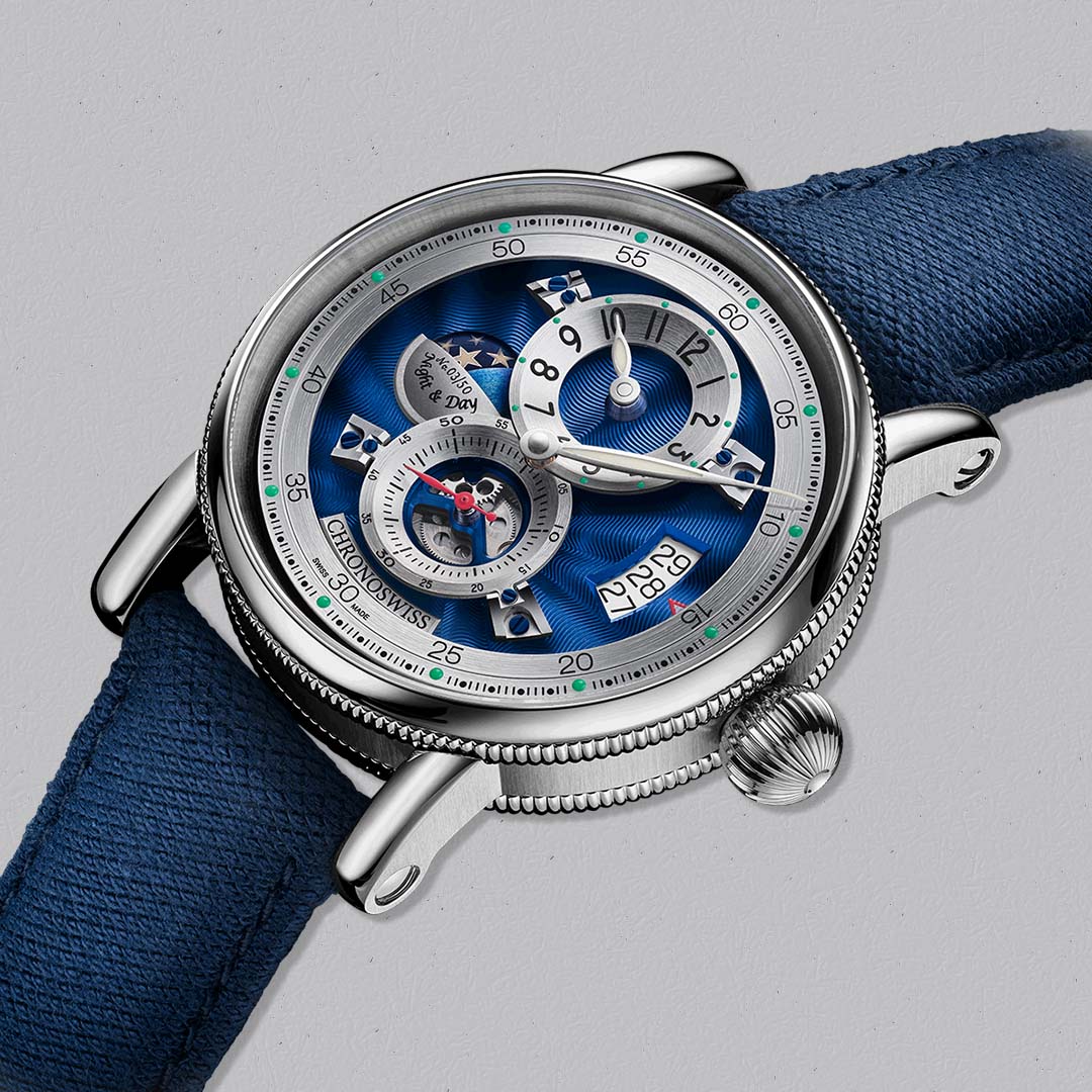 The Evolution Night & Day Midnight by Chronoswiss pairs traditional guilloché craftsmanship with modern regulator design.