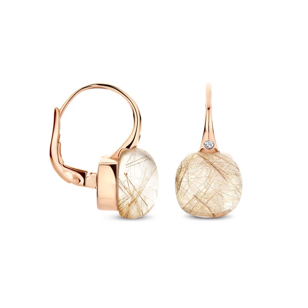 Discover Mini Sweety earrings set with rutile quartz, celebrating organic beauty, light, and understated luxury in a timeless design.
