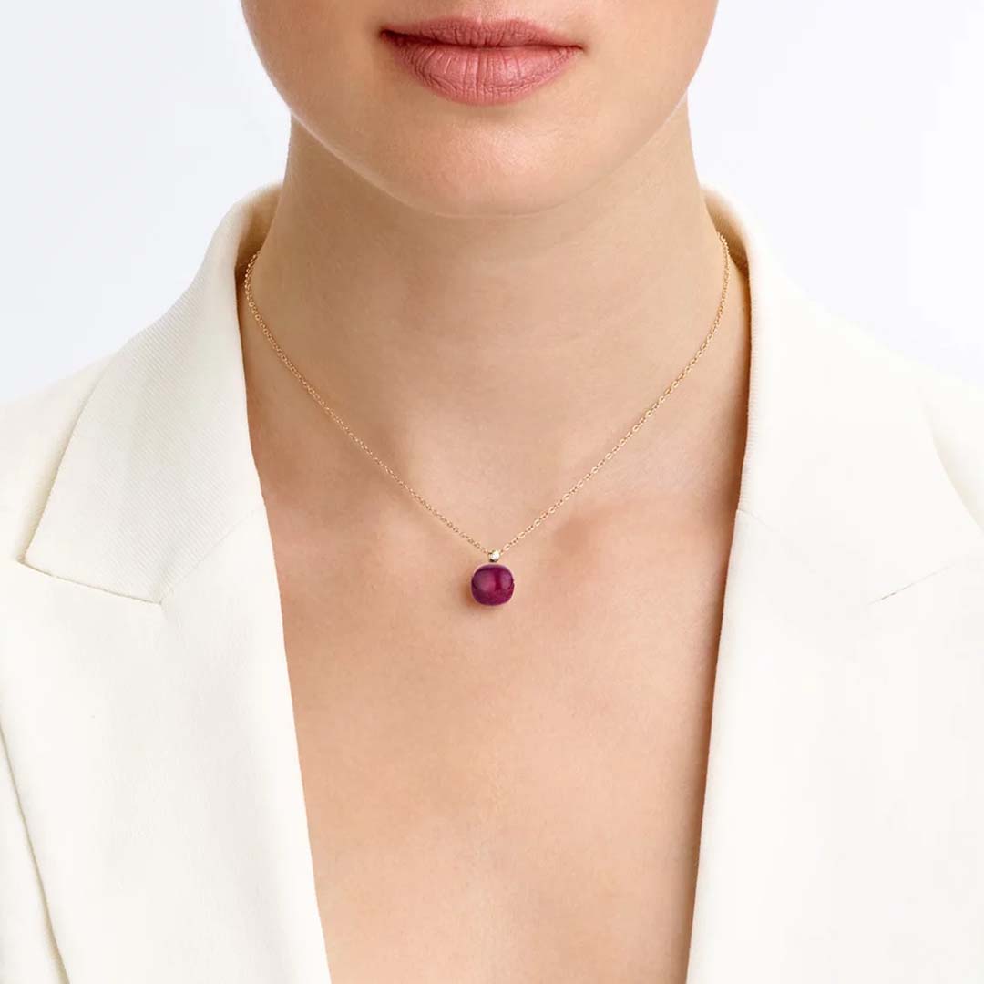 A Mini Sweety pendant set with amethyst and ruby, offering bold colour contrast and sophisticated everyday luxury.