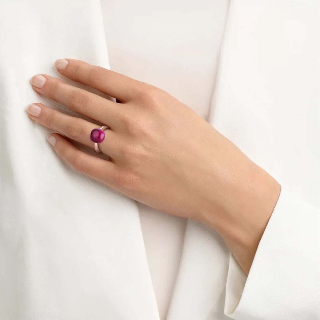 A Mini Sweety ring set with amethyst and ruby, delivering bold colour, modern style, and everyday luxury.