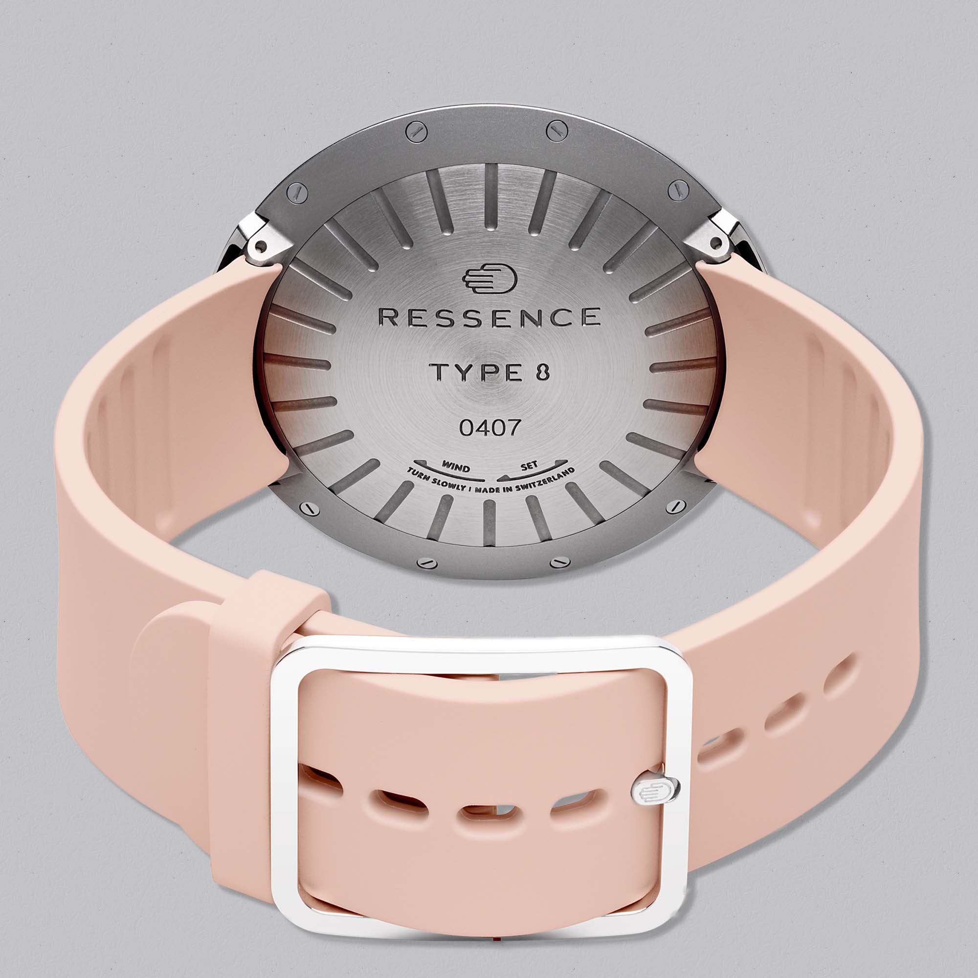 The Type 8 DE1 Pink by Ressence redefines elegance with its orbital time display, pastel pink dial, and sleek grade 5 titanium case.