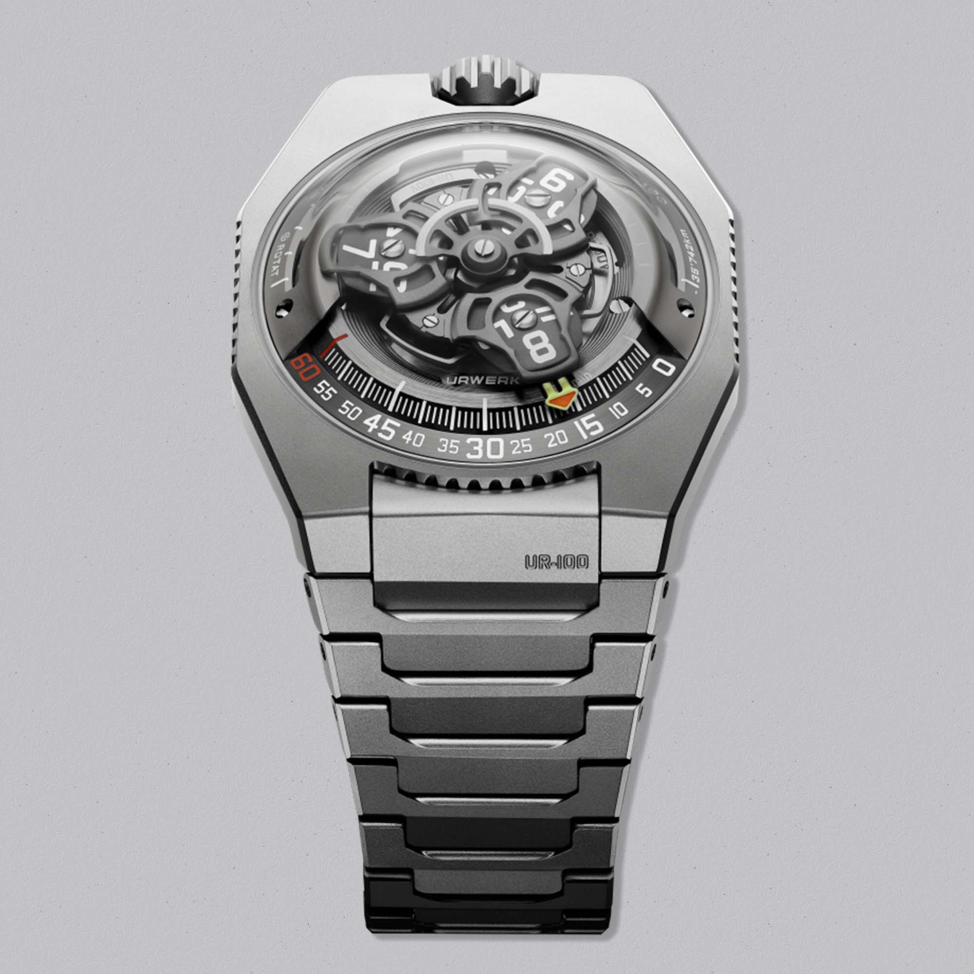 Discover the URWERK UR 100V Magic T in titanium, featuring wandering hours, planetary distance indicators, and a fully integrated titanium bracelet. Available at Swiss Gallery UK.