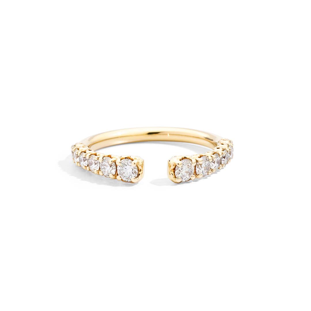 The ANNIVERSARY MORE yellow gold half eternity ring features radiant diamonds set in warm yellow gold, a timeless expression of love and refined elegance.